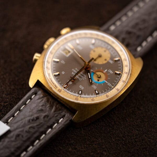 Low angled Omega 176.007 dial view emphasizing the tachymeter ring and two color twenty four hour display