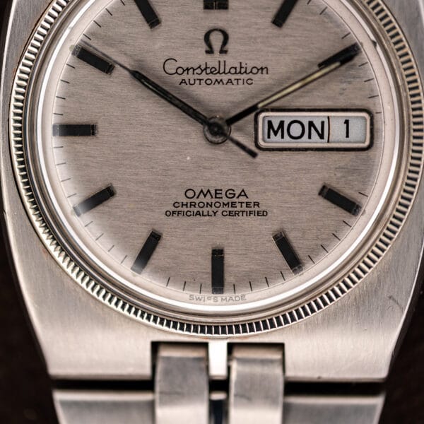 Constellation 168.045 dial close-up with chronometer lettering, framed day-date window and fine coin-edged bezel