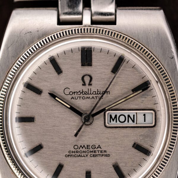 Omega Constellation upper dial detail with applied batons, double twelve marker and automatic signature