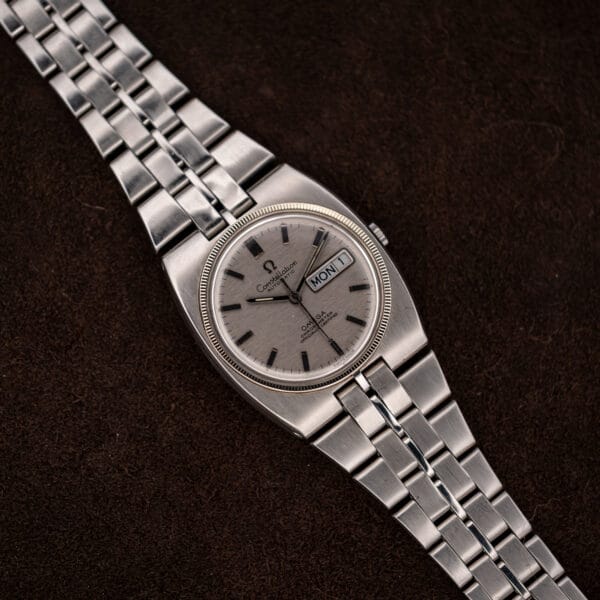 Omega Constellation 168.045 overhead view showing cushion case shoulders and paired center bracelet links
