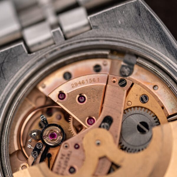Close-up of Omega 751 caliber stamp and serial 29461561 on the Constellation movement bridge