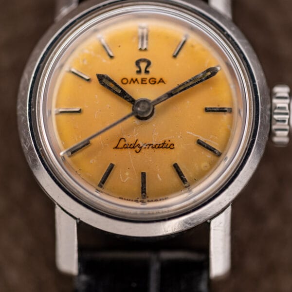 Ladymatic 11000 SC dial close-up showing Omega lettering, script signature and slender central seconds hand