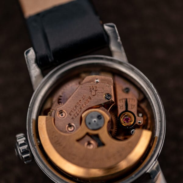 Omega Ladymatic movement close-up with caliber 455 stamp, seventeen-jewel inscription and semicircular winding rotor