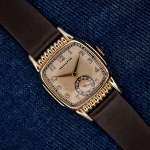 Hamilton Roland with Arabic numeral silver dial, ribbed gold filled case ends and brown leather strap
