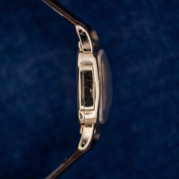 Opposite Hamilton Roland case profile with recessed side panel, raised crystal and curved lugs