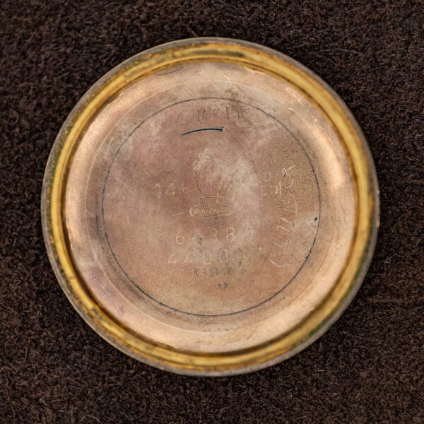 Movado inner caseback showing USA stamp, reference 64389 and gold-filled case markings