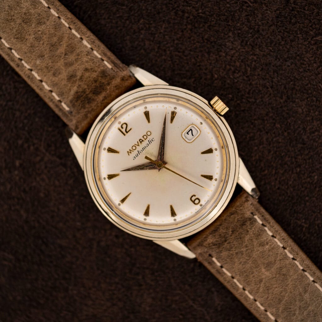 Movado Automatic 64389 with white dial, framed date window and stitched leather strap