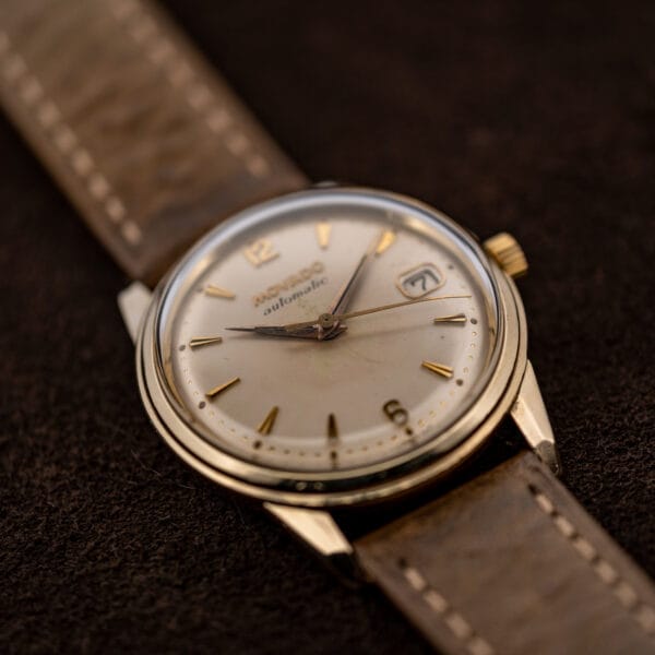 Movado 64389 lower dial perspective showing applied six and slender central seconds hand