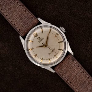 Omega Seamaster 2635-9 SC with eggshell dial, applied Arabic numerals, dauphine hands, and brown textured strap