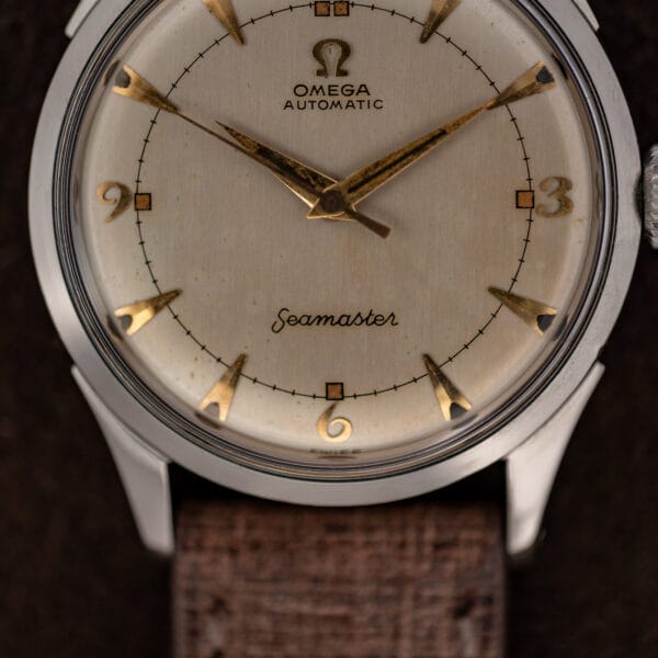 Omega Seamaster 2635-9 SC lower dial with script signature, applied six, and tapered gold toned markers