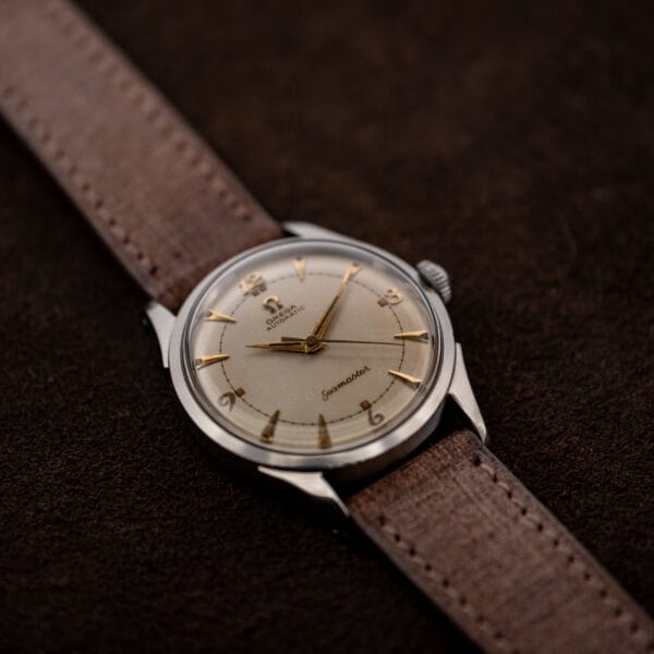 Oblique Omega Seamaster 2635-9 SC face showing dauphine hands, central seconds, and applied quarter numerals