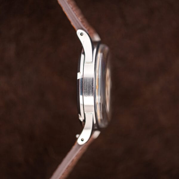Left side profile of Omega Seamaster 2635-9 SC with curved lugs, domed crystal, and steel case
