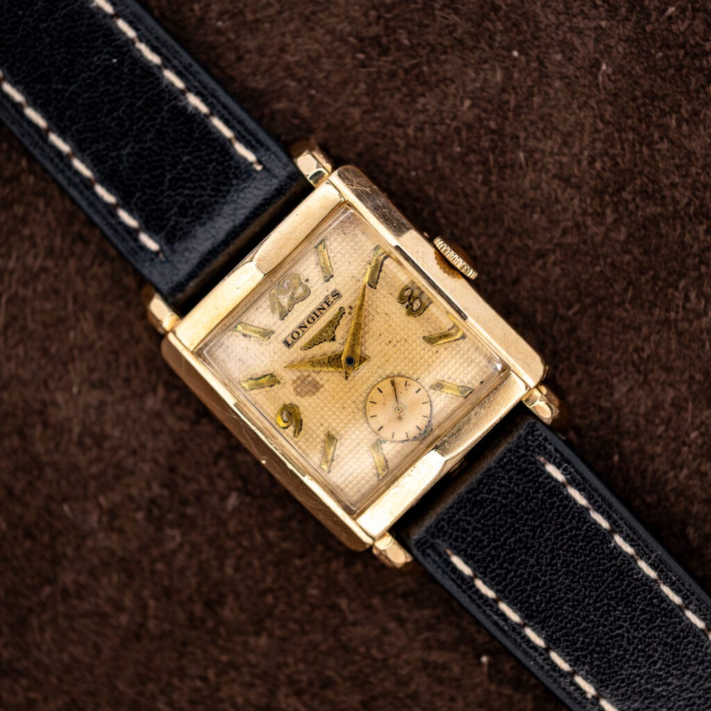 Longines square gold filled dress watch with waffle dial, applied markers and contrast-stitched black leather strap
