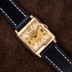 Longines square gold filled dress watch with waffle dial, applied markers and contrast-stitched black leather strap