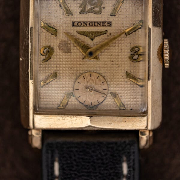 Lower Longines waffle dial detail with concentric subsidiary seconds and applied flared hour markers