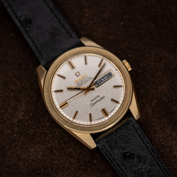Omega Seamaster three-quarter view highlighting angular lugs, baton markers and the framed day-date window