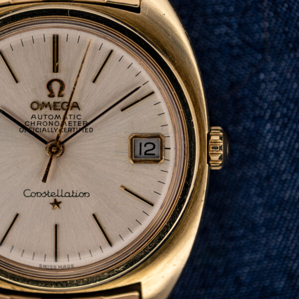 Omega Constellation 168.017 crown-side detail showing framed date, slender hour markers and ridged crown