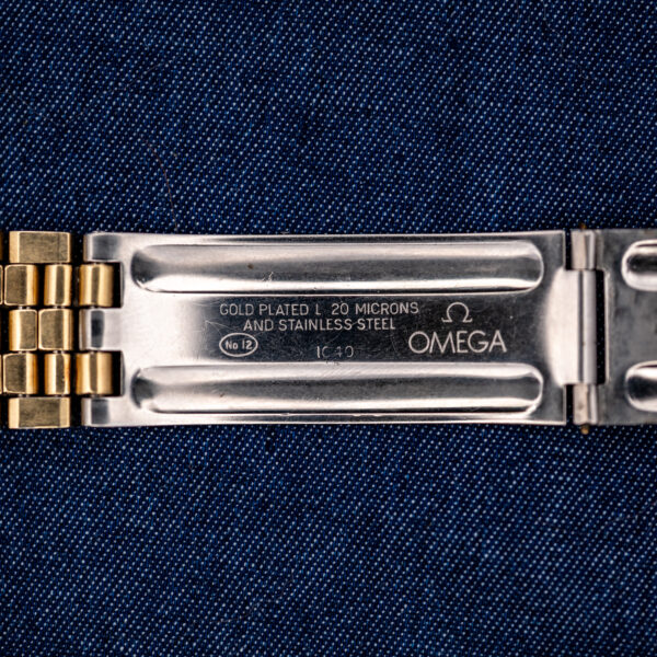 Omega Constellation bracelet clasp interior with Omega signature, material lettering and stamped identification numbers