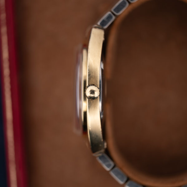Omega Constellation 168.017 side profile showing Omega-signed crown and raised crystal above the case
