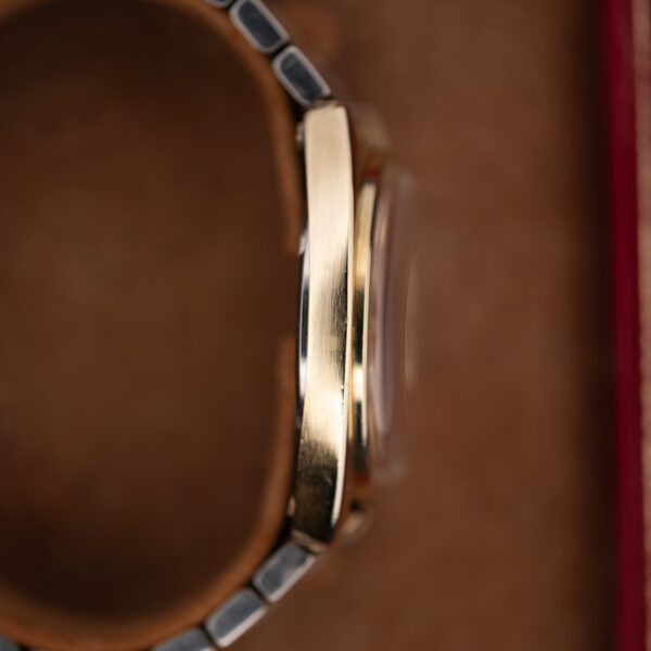 Omega Constellation 168.017 opposite flank with smooth case side, projecting crystal and bracelet ends
