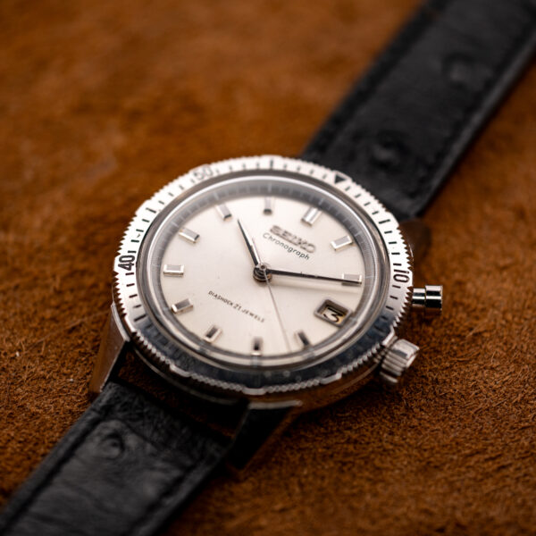 Seiko chronograph from a low opposite angle, with the single chronograph pusher sitting just above the crown