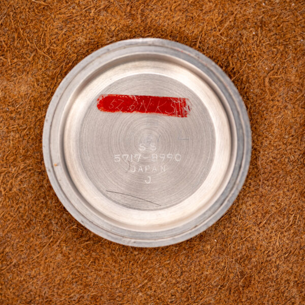 Inside of the Seiko caseback stamped SS, 5717-8990, JAPAN and J, beside a red painted notation area