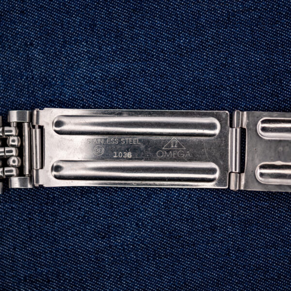 Omega bracelet clasp interior displaying Stainless Steel inscription, Omega signature and stamped 1036 identification number