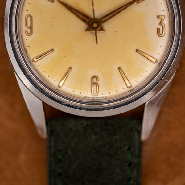 Zenith lower dial detail with Arabic six, applied baton markers and Swiss Made lettering beneath