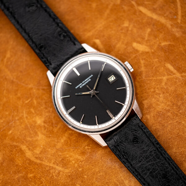 Girard Perregaux Gyromatic full view with angular lugs, framed date and textured strap extending outward