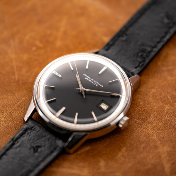 Girard Perregaux Gyromatic oblique view showing raised crystal, round case and textured strap attachment