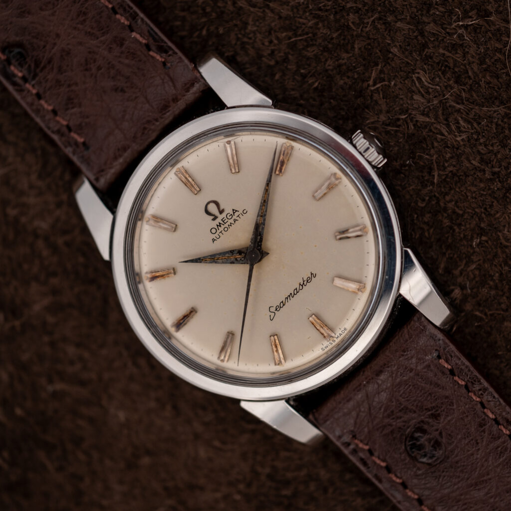 Omega Seamaster 14761 diagonal portrait with no-date dial, pointed hands and choco brown ostrich strap