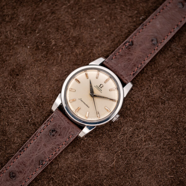 Omega Seamaster 14761 wide diagonal arrangement displaying complete dial and both sections of ostrich strap