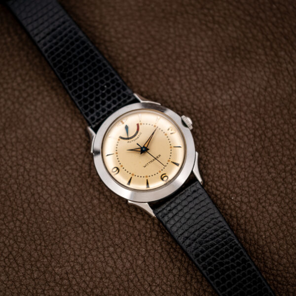 Wittnauer 2092 full view emphasizing broad bezel, applied hour markers and separate upper reserve indicator