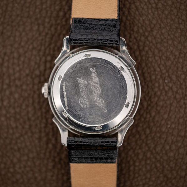 Wittnauer 2092 caseback with cursive personal engraving, edge material stamp and surrounding opening notches