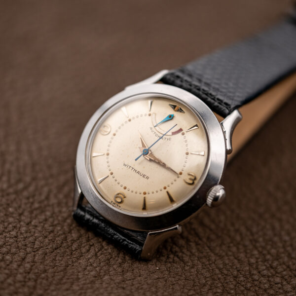 Wittnauer 2092 angled dial view with separate reserve hand and red segment on the curved scale
