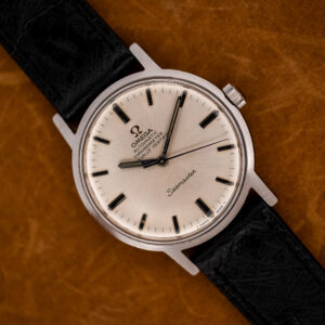 Omega Seamaster 167.070 chronometer from above, silver radial-brushed dial on a black ostrich strap
