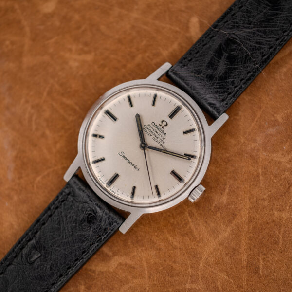 Diagonal front view of the Omega 167.070 chronometer dial with baton markers and black strap