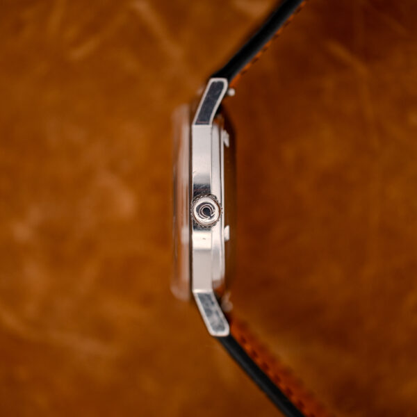 Crown-side profile of the Omega Seamaster 167.070 showing the Omega-signed crown and slim case