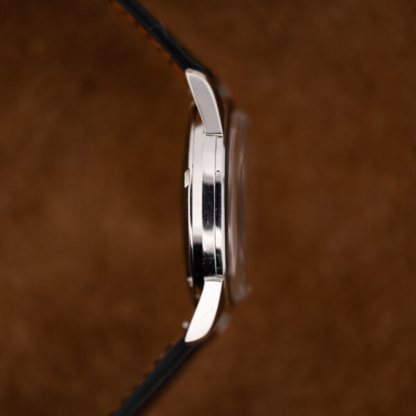Opposite profile of the round steel Seamaster case showing the flank, curved lugs and raised crystal