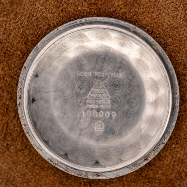 Inner caseback of the Omega Seamaster stamped ACIER INOXYDABLE, reference 166009 and an LL maker cartouche