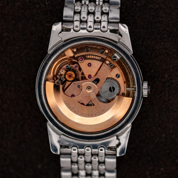 Omega caliber 552 automatic movement inside the 1961 Seamaster, with signed rotor and serial bridge