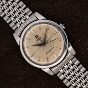 1961 Omega Seamaster 14761 with off-white crosshair dial on a silver-tone steel bracelet, angled front view
