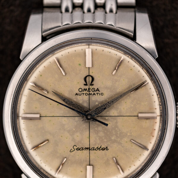 Upper dial detail of the Omega Seamaster showing Omega Automatic text and the intersecting crosshair lines