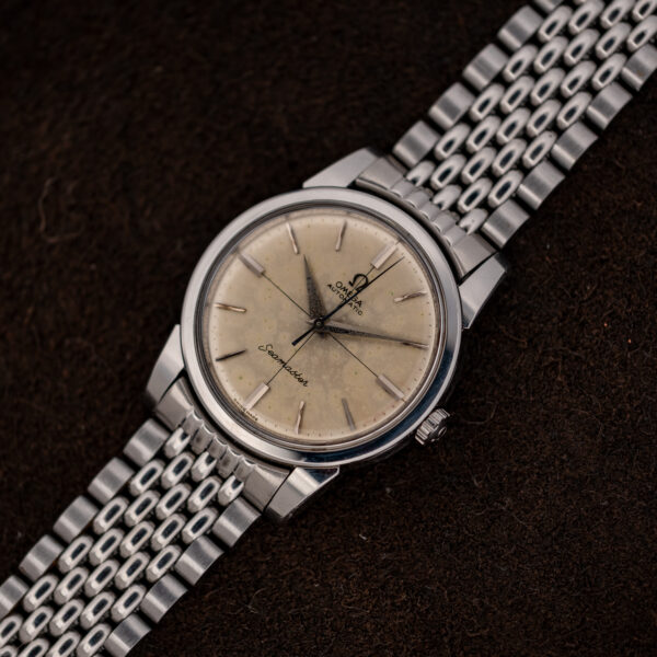 Full diagonal view of the Omega Seamaster 14761 crosshair dial and multi-row steel bracelet