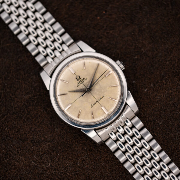 Omega Seamaster crosshair dial from the opposite angle, showing rectangular quarter-hour markers and slim batons