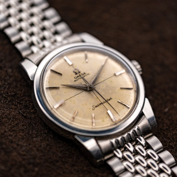 Oblique close view of the Omega Seamaster crosshair dial with tapered hour markers and broad hands