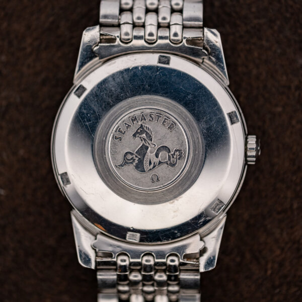 Back of the Omega Seamaster 14761 with seahorse medallion and the bracelet end links attached