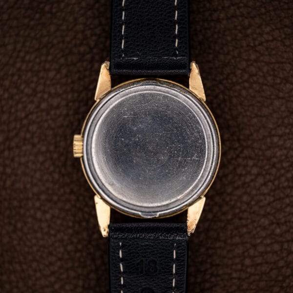 Girard Perregaux Sea Hawk B-1801 underside showing plain circular caseback and attached stitched strap