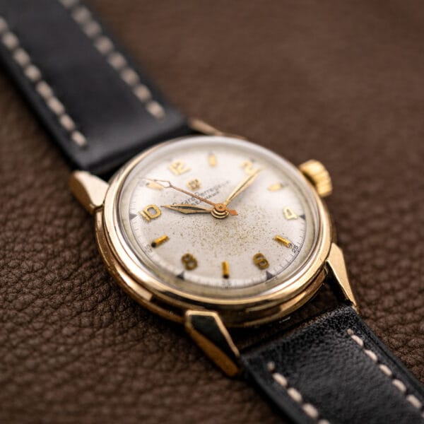 Girard Perregaux Sea Hawk B-1801 low angled view emphasizing dial patina and raised crystal