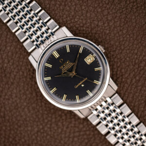 Omega Constellation 168.010 overhead view with black dial, paired hour markers and stainless steel bracelet